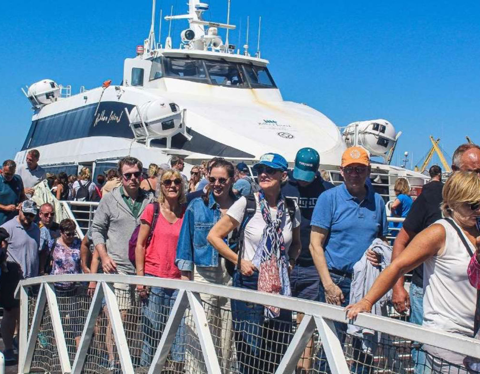 Tourists disembarking from the Robben Island Ferry at the V&A Waterfront.